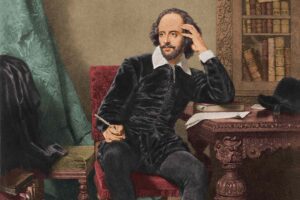 Image of Shakespeare at a desk writing his Personal Development Plan