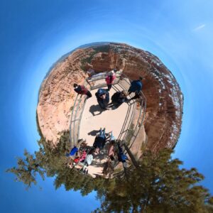 360 view of team on a ledge overlooking the grand canyon